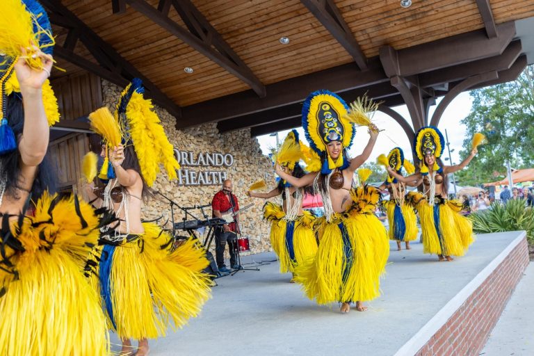 Cocokeyluau Luau On International Drive Luau Dancers Yellow Costumes Stage