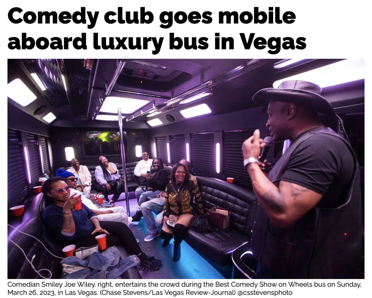 A comedian performs inside a luxury bus filled with audience members. Keeponsmilen Best Comedy Show On Wheels Comedy Bus Show Luxury Interior