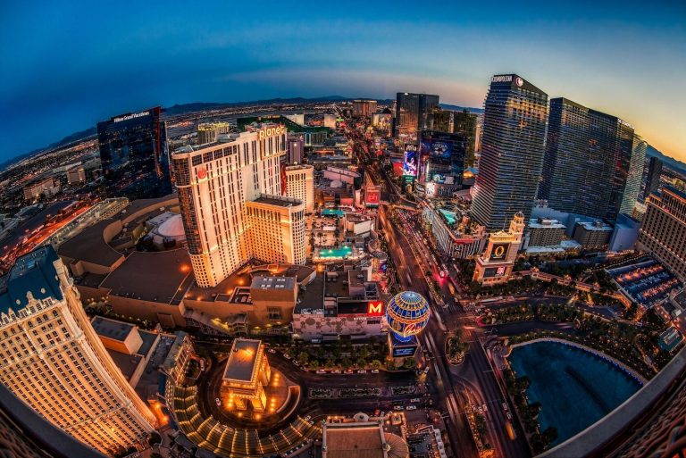 Aerial view of Las Vegas skyline illuminated at night. Keeponsmilen Best Comedy Show On Wheels Las Vegas Skyline Night Lights