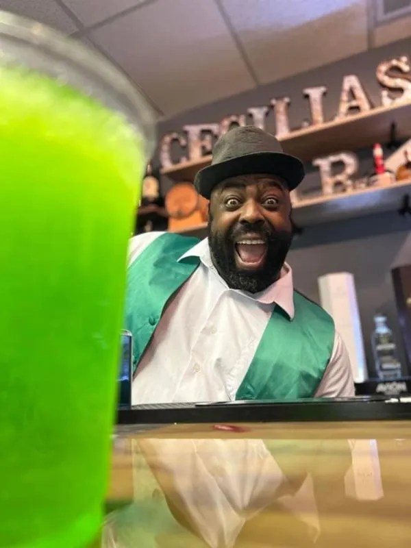 rigatonysdinnershow_christmas-at-myrtle-beach-bartender-green-drink-smiling Rigatonysdinnershow Christmas At Myrtle Beach Bartender Green Drink Smiling