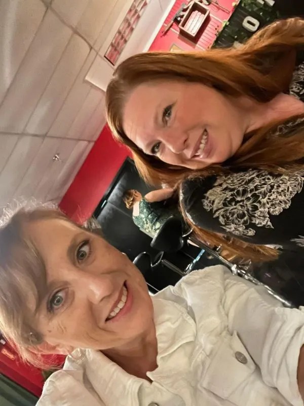 Two women smiling for a selfie in a restaurant setting. Rigatonysdinnershow Christmas At Myrtle Beach Dinner Show Myrtle Beach Friends