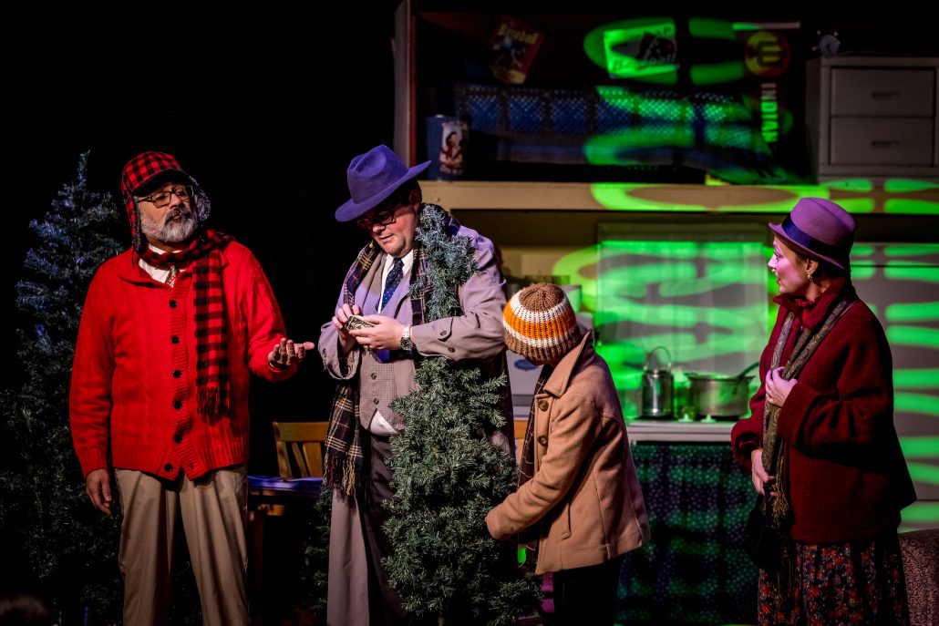 Four actors in colorful costumes interact on stage with props. Theshepherdofthehills A Christmas Story Dinner Show Dinner Show Theater Performance Costumes