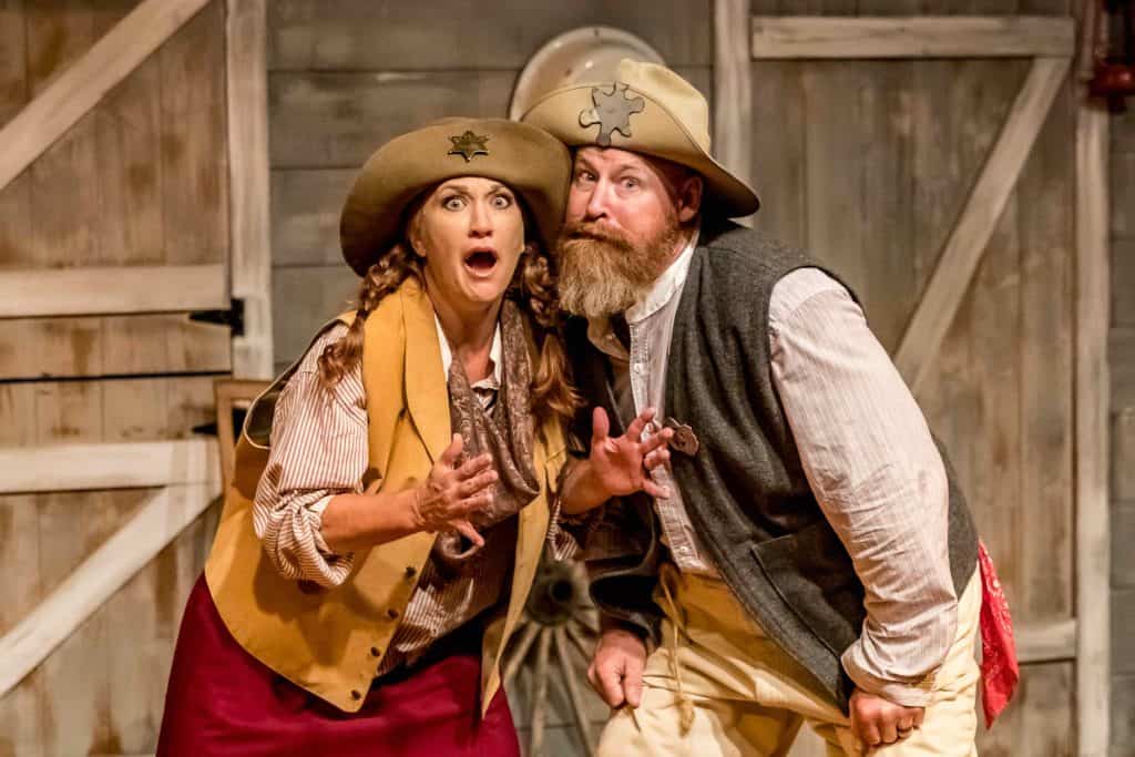 Two actors in western costumes express surprise on stage. Theshepherdofthehills Branson S Whodunnit Hoedown Murder Myste Murder Mystery Dinner Show Actors